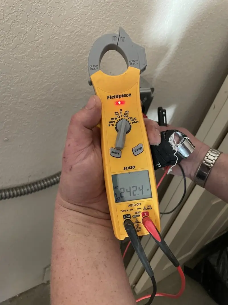 Voltage testing with clamp meter during Recessed Lighting Installation in Brook Highland